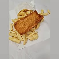A battered fish supper wrapped with chips.