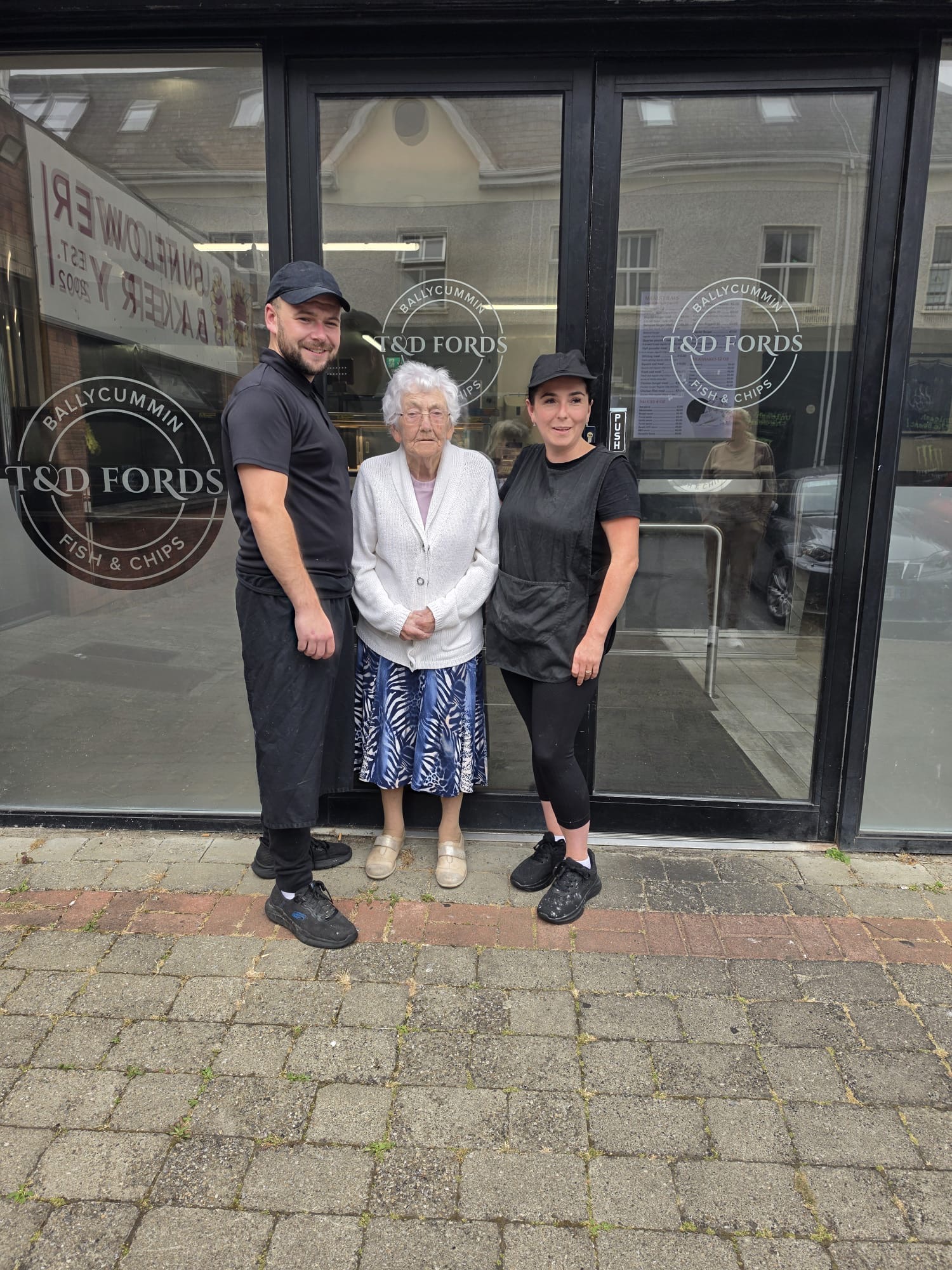 The T & D Ford Fish and Chips family outside the shop in Ballycummin Village.